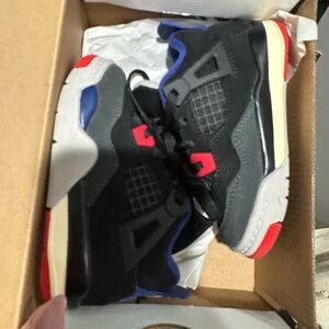 Kids Black and Red Sneakers 
Jordan Retro 4 worn twice no sign of wear